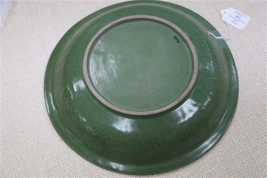 A Chinese celadon glazed twin fish dish, Qing dynasty, D. 34.5cm, wood stand